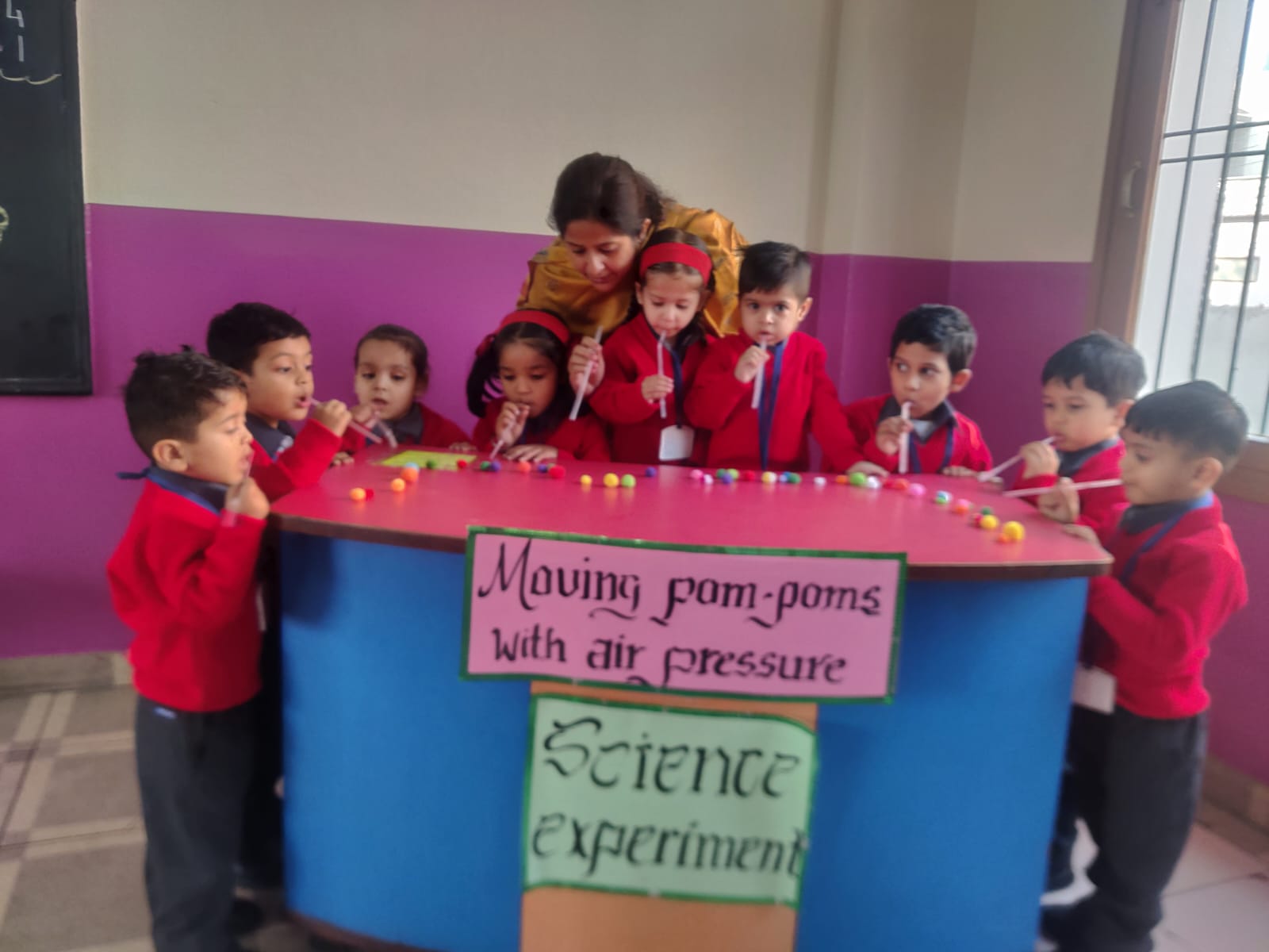 NURSERY II SCIENCE ACTIVITY II MOVING POM POMS WITH AIR PRESSURE